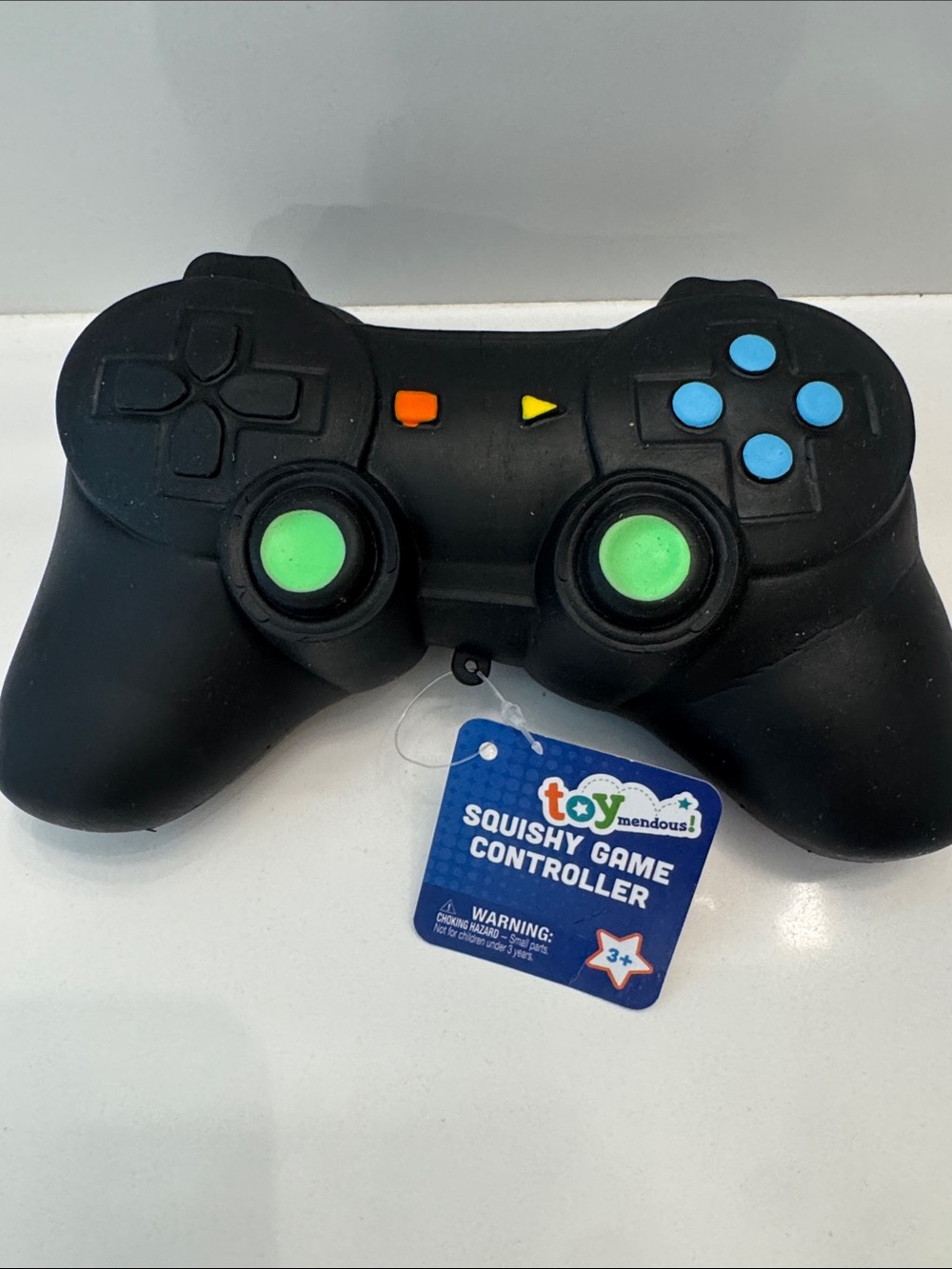 Black Squishy Game Controller Stress Toy with Green and Blue Buttons
